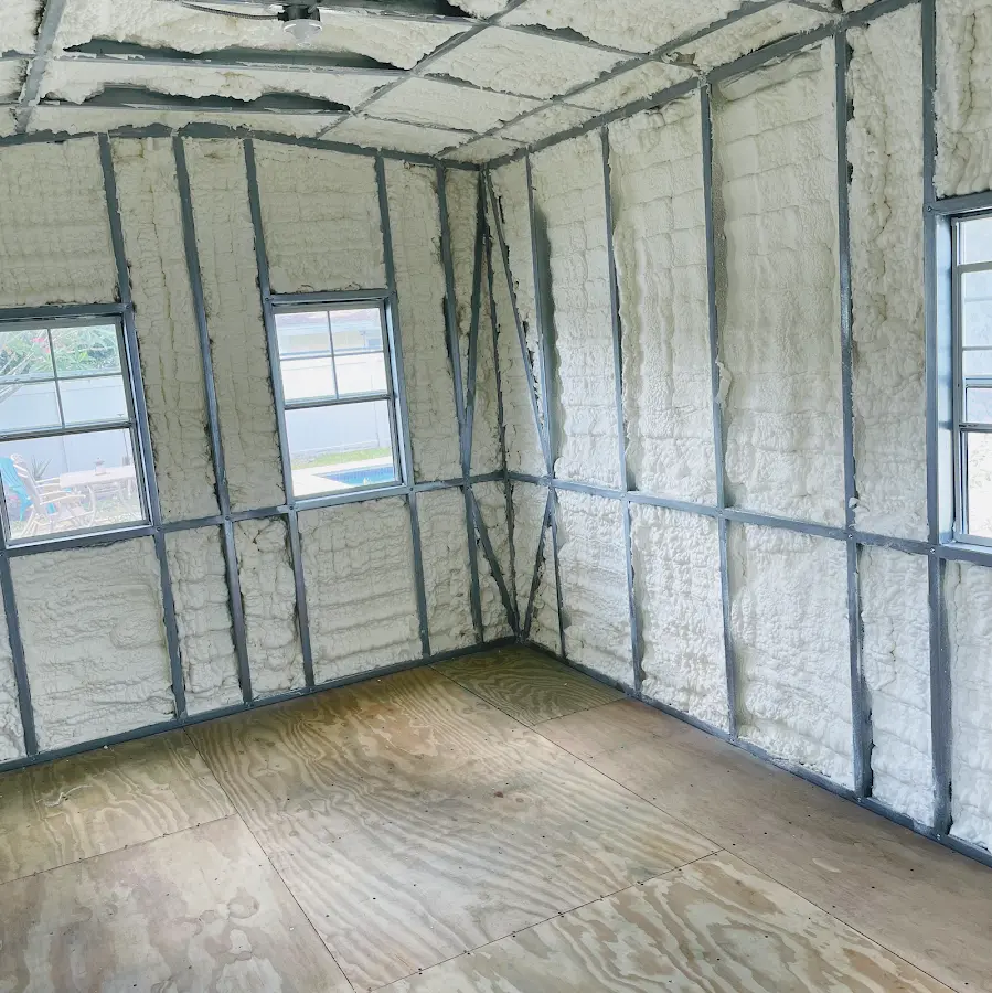 Closed-cell spray foam insulation applied to wall cavities in a residential project in Aurora